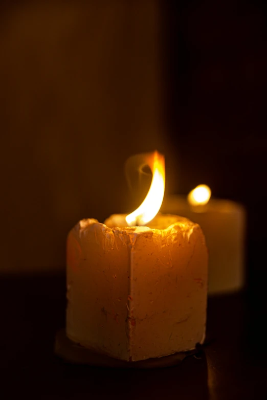 a candle sitting on top of a wooden table