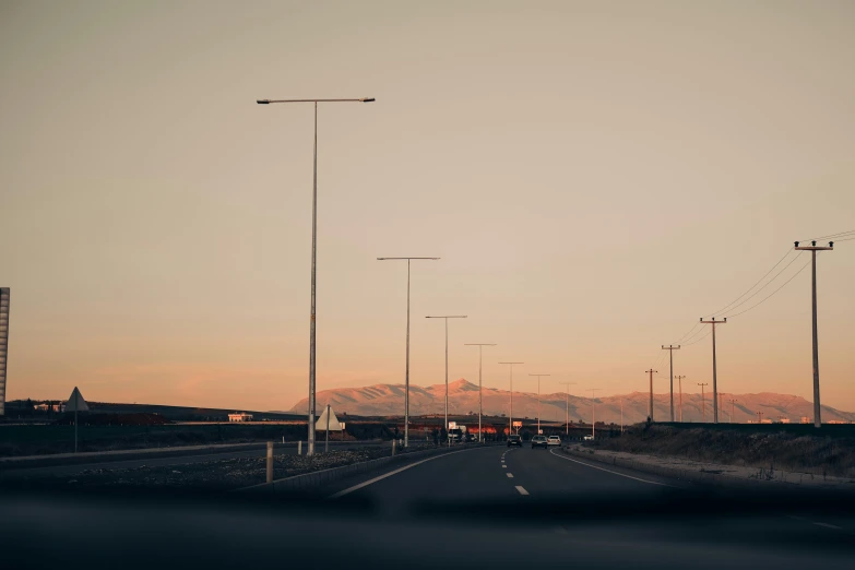 a highway in the middle of nowhere with a lot of traffic going down it