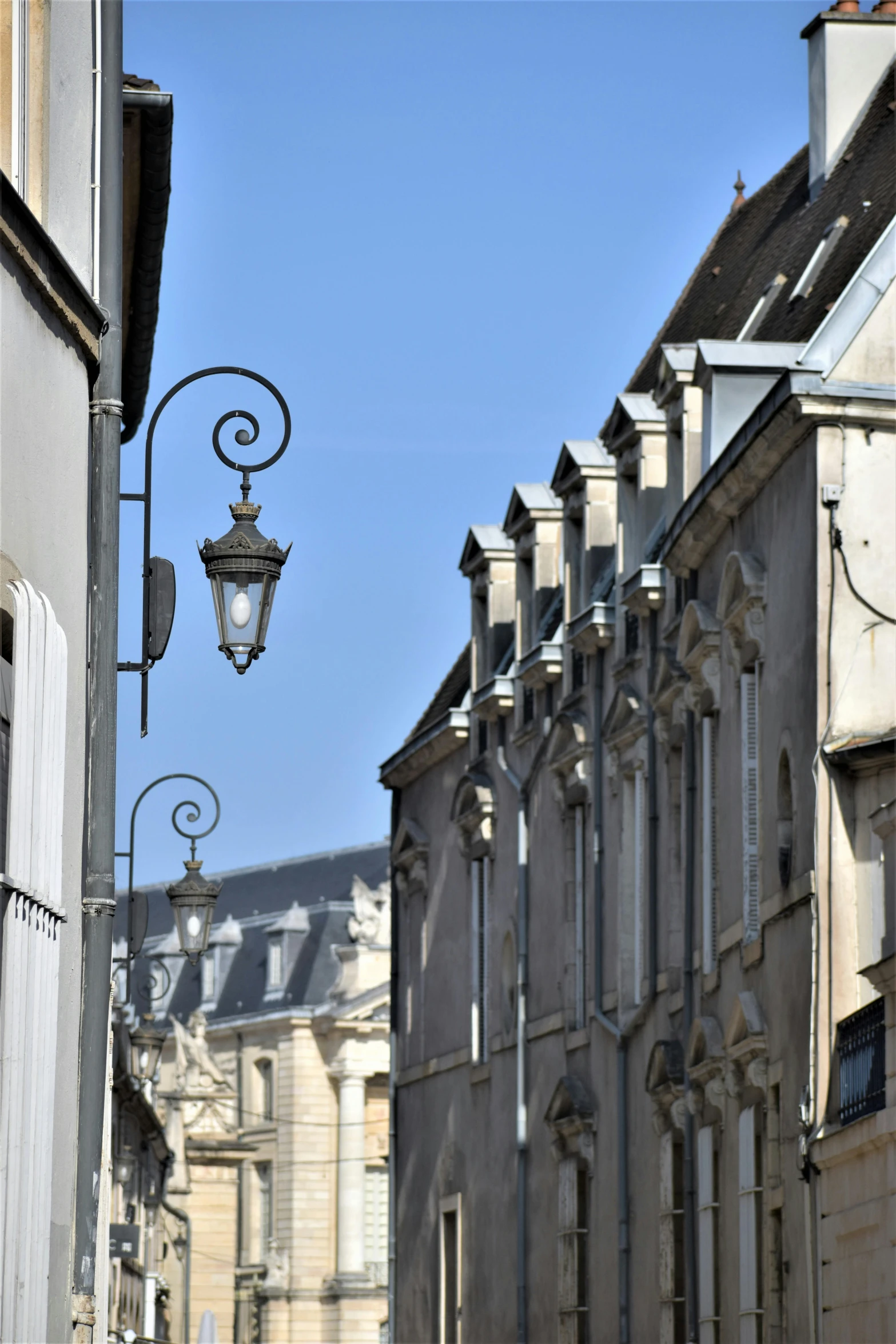 a street light in front of a row of buildings