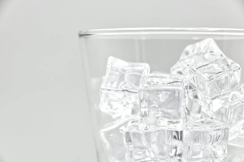 an ice cube is shown in a glass of water