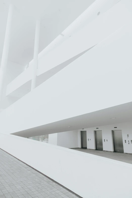 a group of tall buildings with white pillars next to them