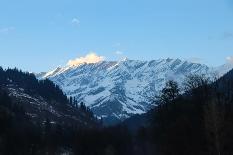 a mountain that has some snow on it