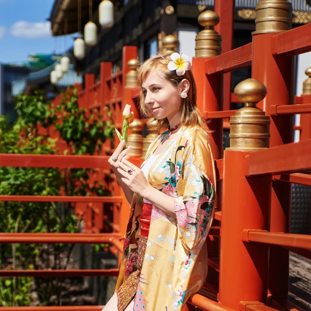 young woman in kimono with an oriental flower and gold hair comb