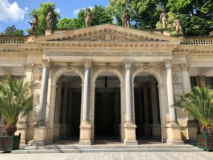 a very large stone building sitting on top of a stone plaza