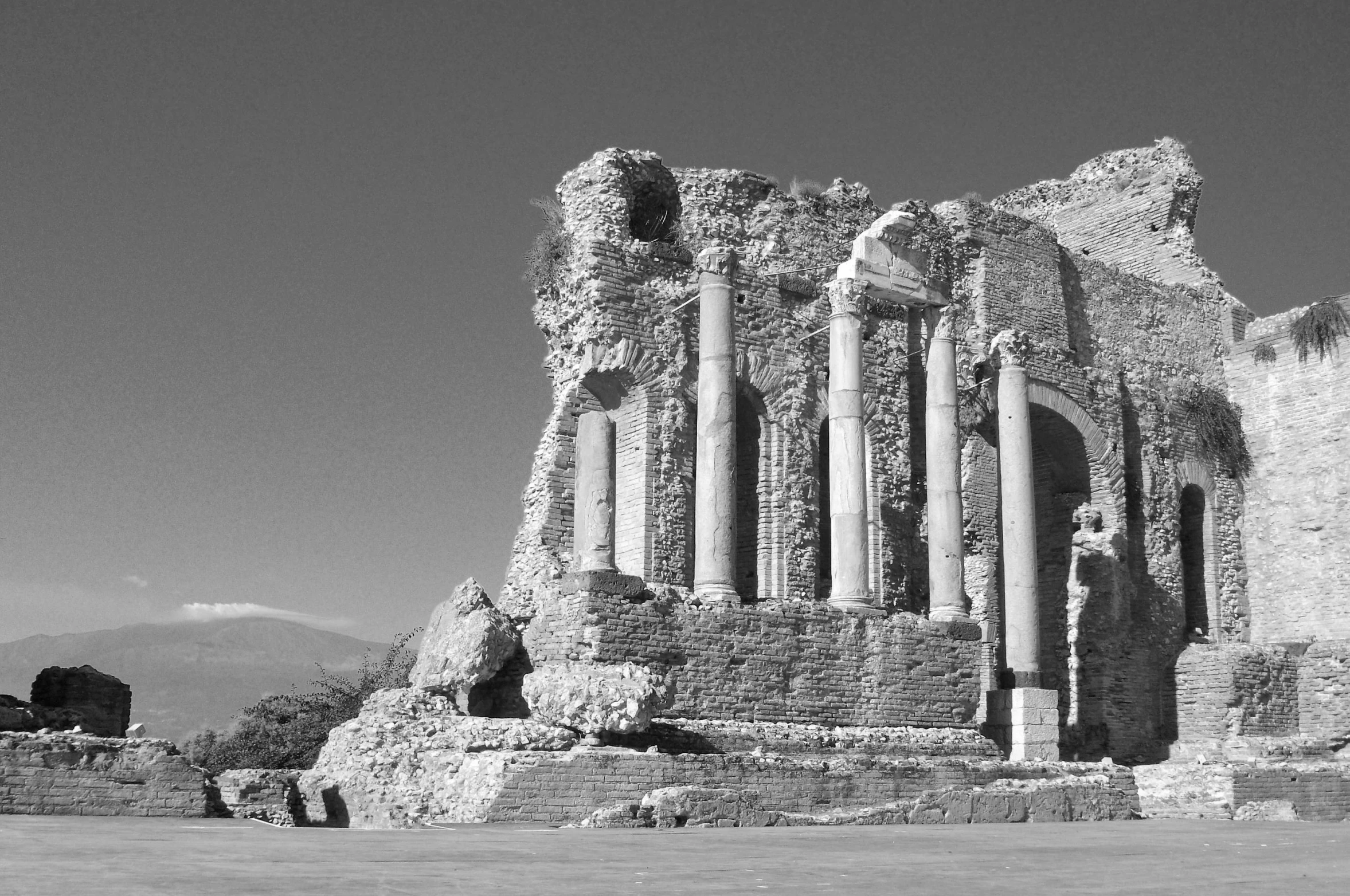 black and white pograph of ruins with arches