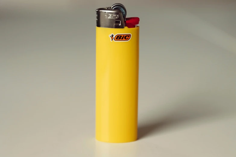 a lighter is sitting on the table near the lighter