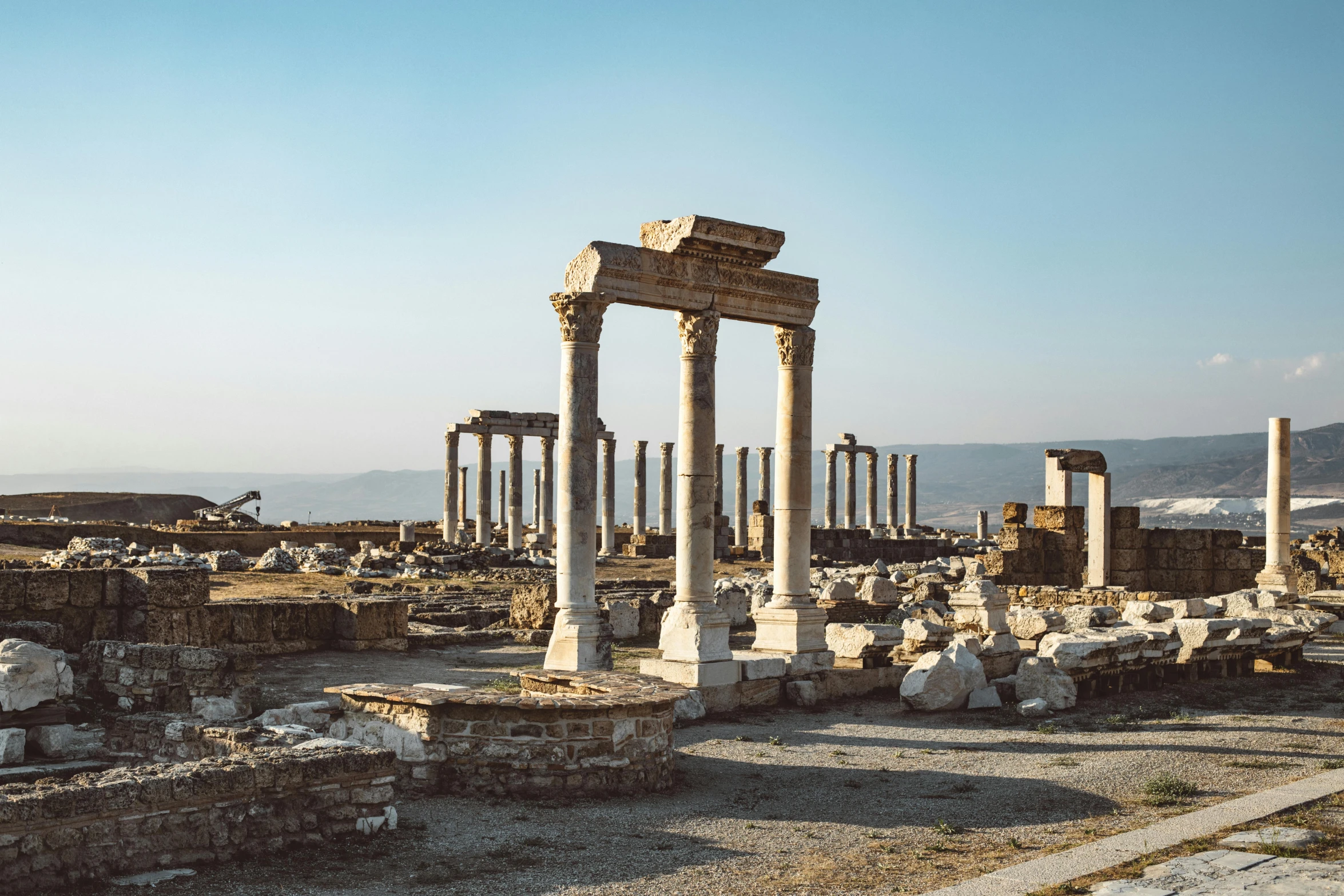 a ruin of ancient ruins, with old buildings surrounding them