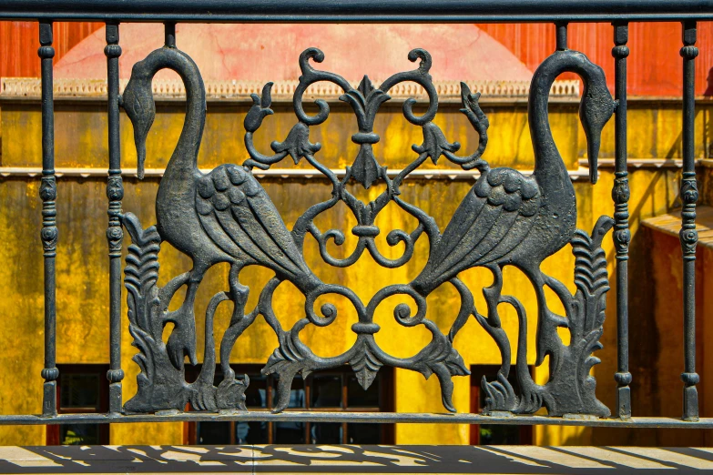 an image of a wrought iron fence that is in the shape of swans