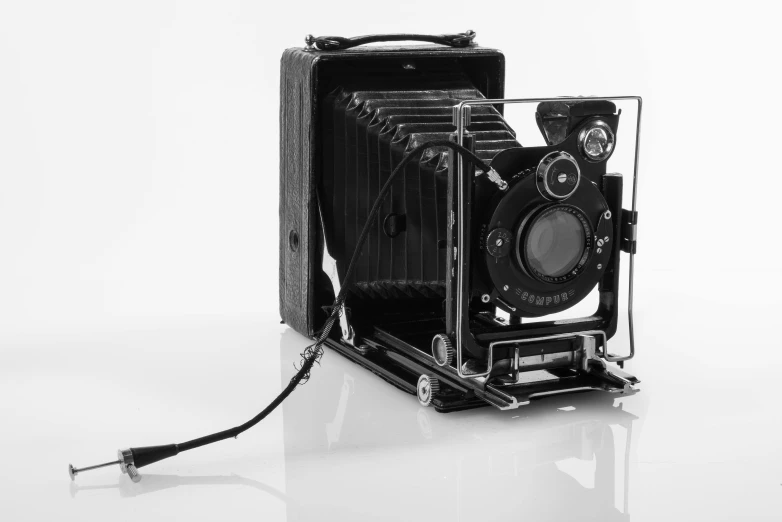 a vintage brownie camera, with its case open