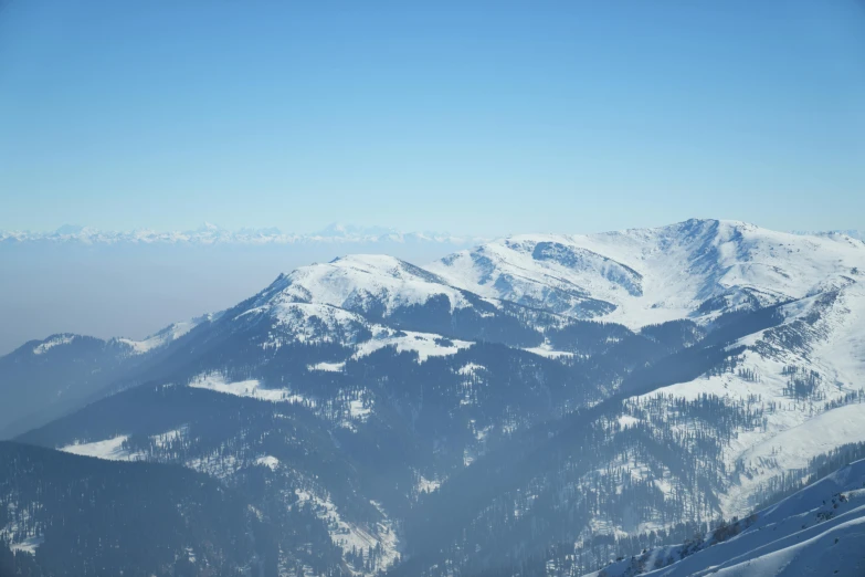 a snow covered mountain peak in the distance