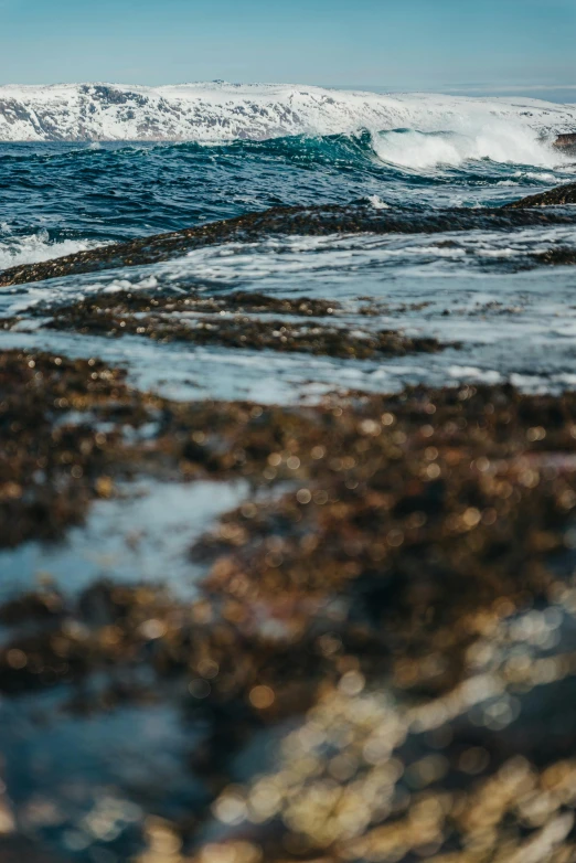 waves crashing on the rocky coast in the distance