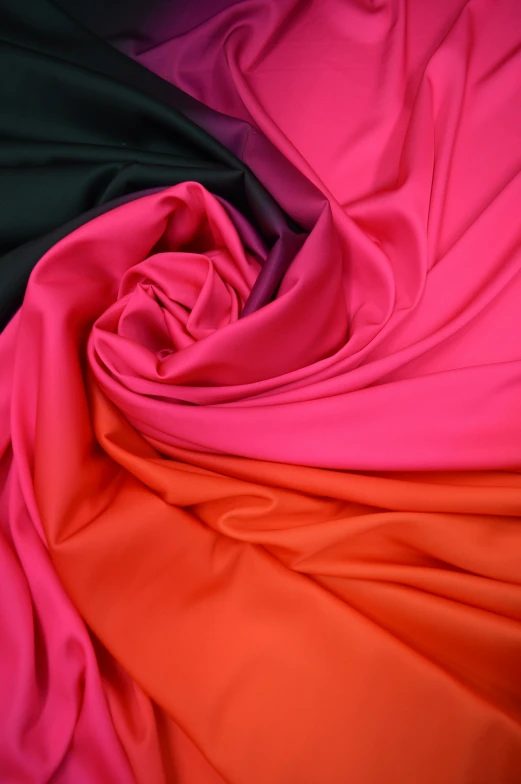 close up of pink and green sheets on the bed