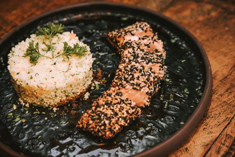 an image of salmon and rice on a plate