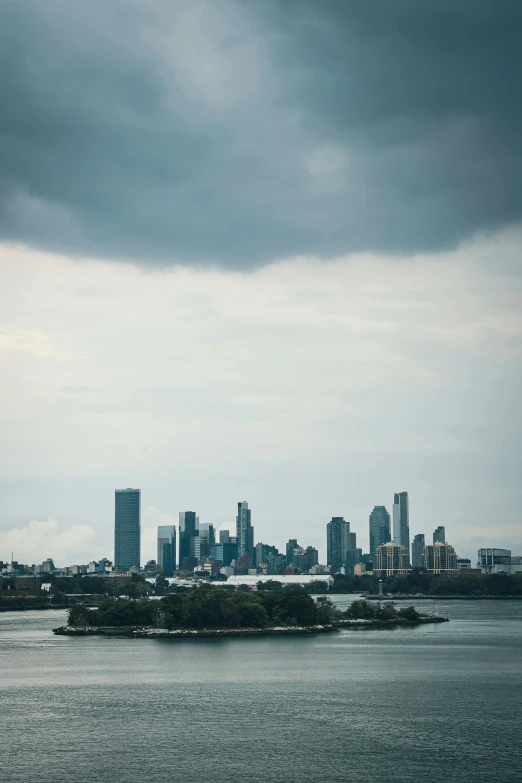 the skyline has several skyscrs near the water