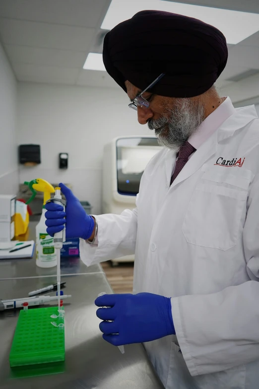 a person in lab coat with pipe and flask