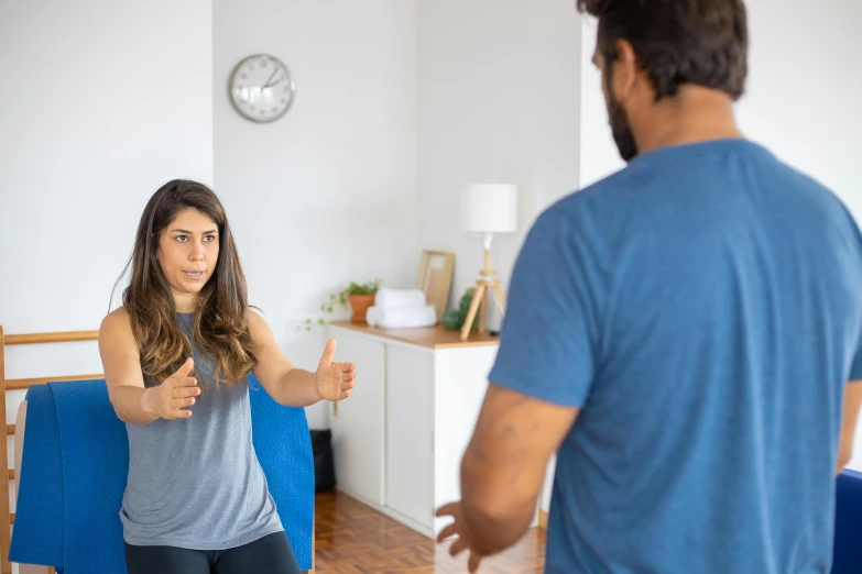 the woman is giving a thumbs up in the room