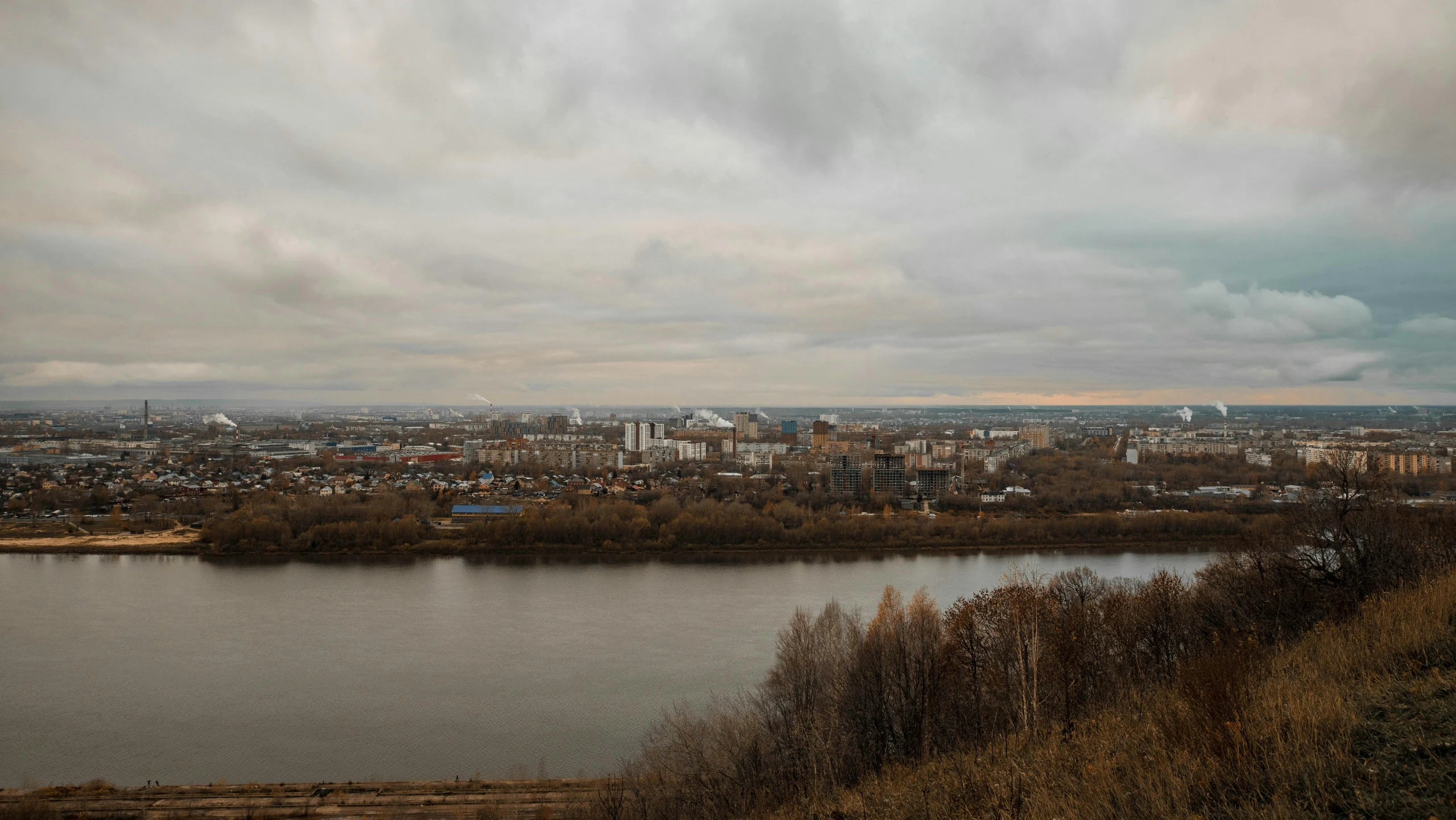 city view across a river from top of hill