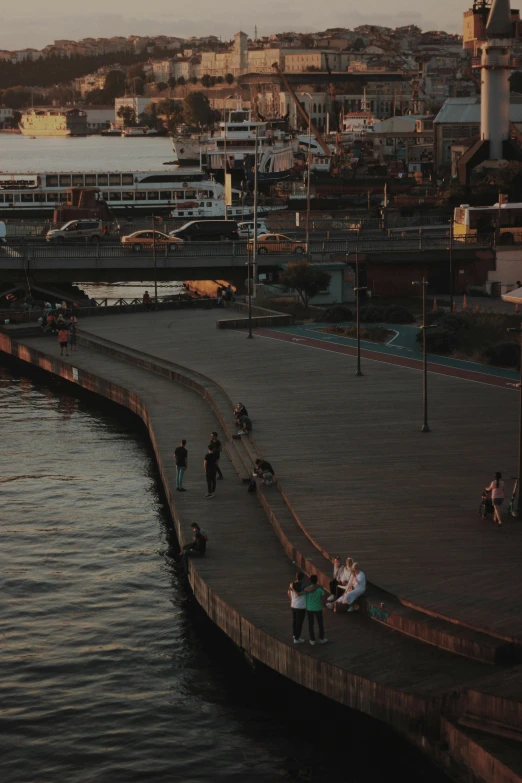 a group of people walking on the waterfront