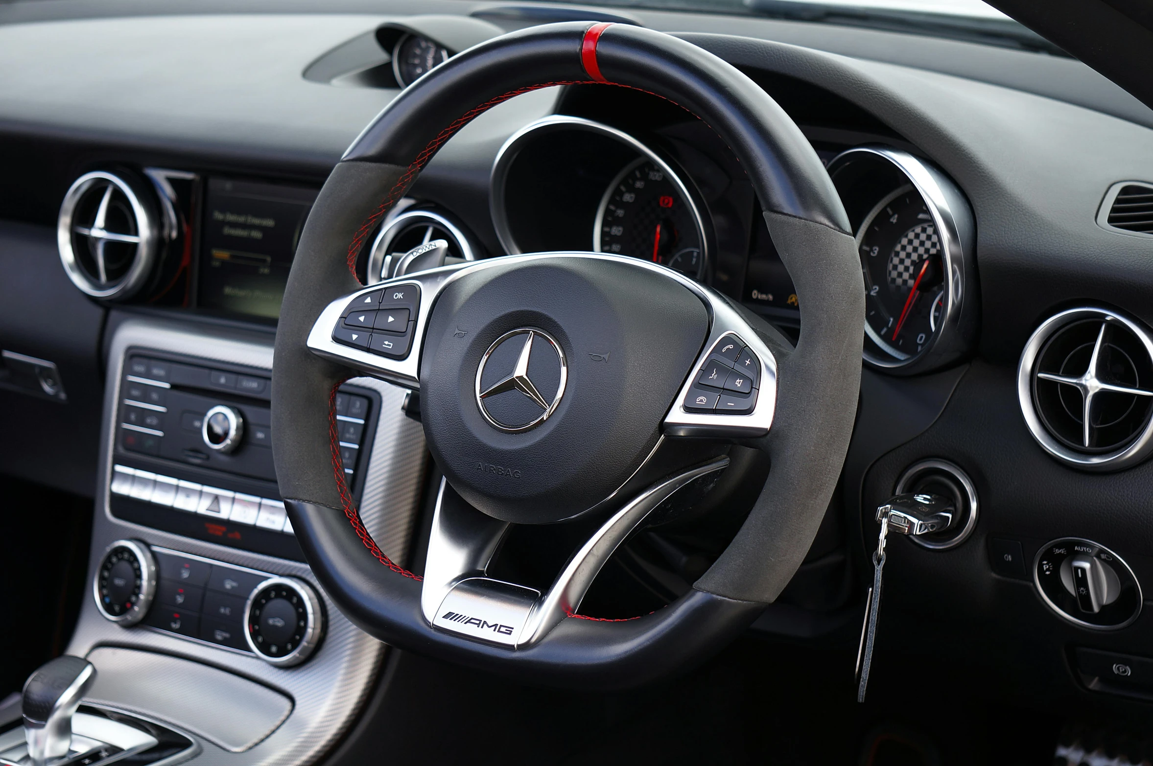 the driver's dashboard and info display in a mercedes - benz car