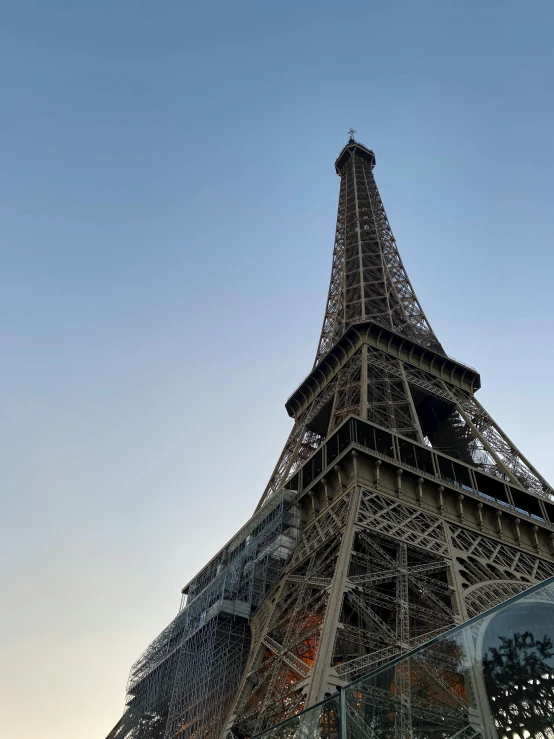 the top of the eiffel tower against a sky background