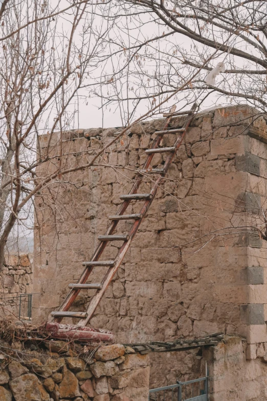 an old stone wall that has been built with wooden steps