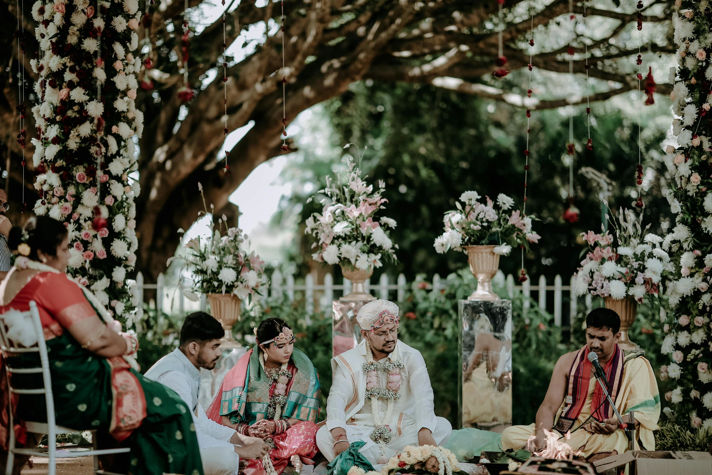 a group of people sitting on top of a wooden bench