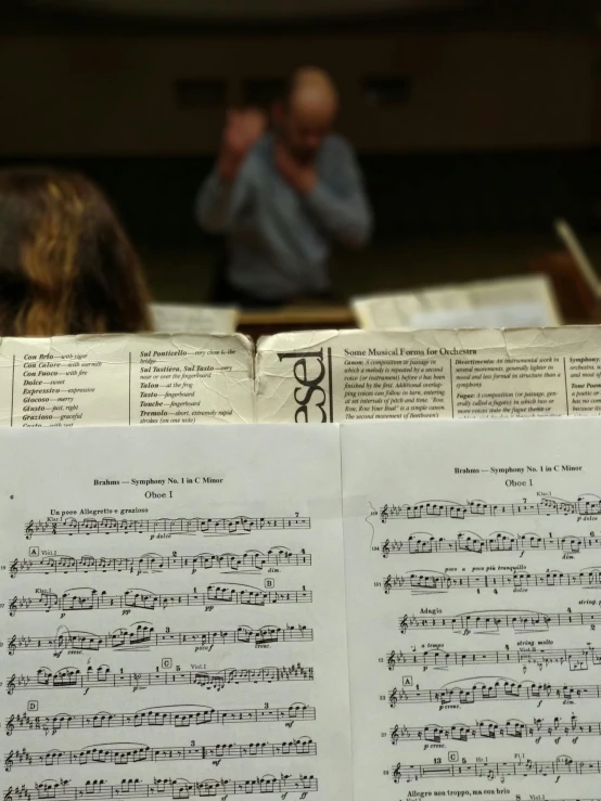 an open piece of musical sheet on top of music sheets
