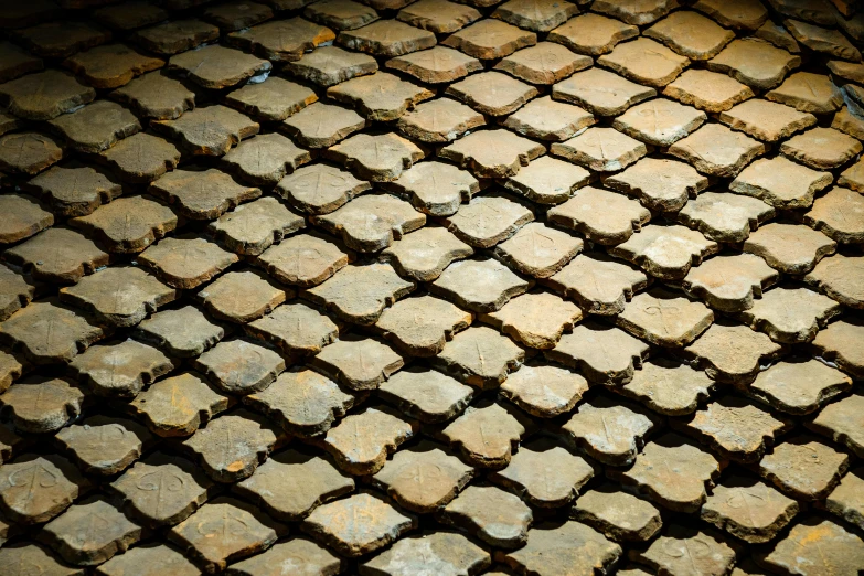 an old tile pattern shows a cobblestone design