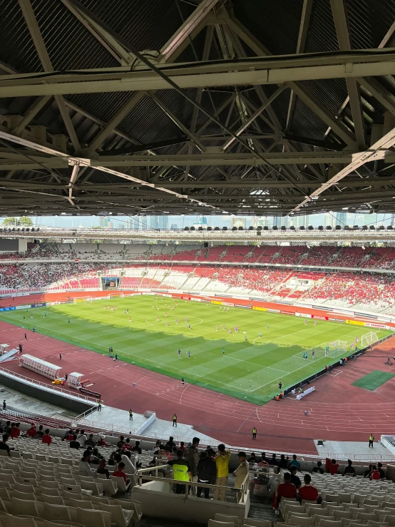 view from the stands of a stadium with people watching