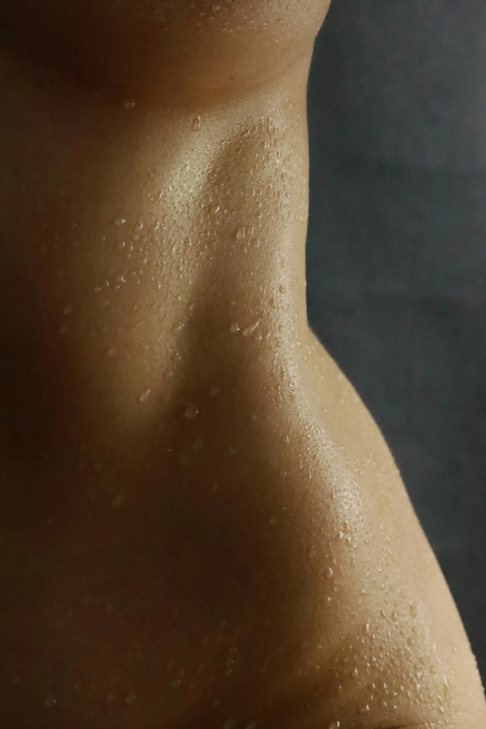 a man's bare back shows very tiny patches