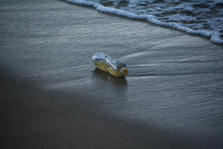 a bottle that has been washed into the beach