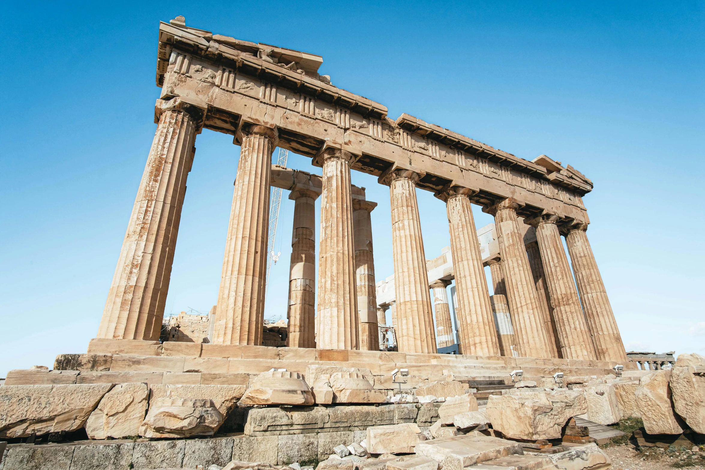 two large stone ruins in front of blue sky