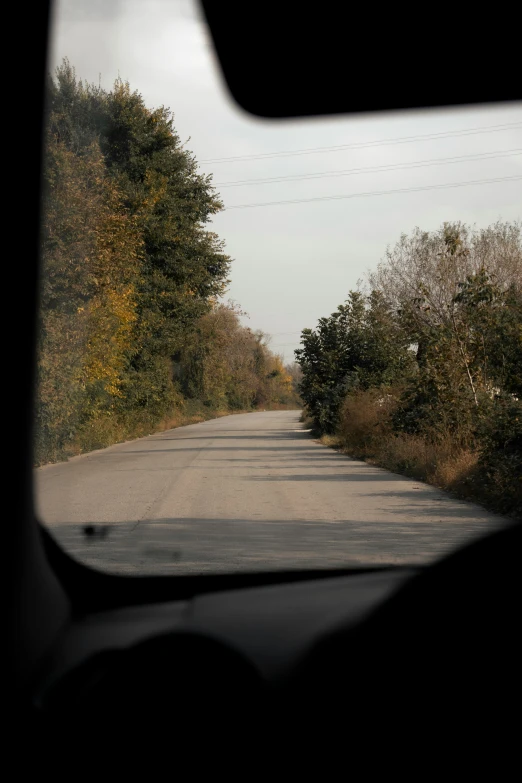 a truck on the road going uphill behind it