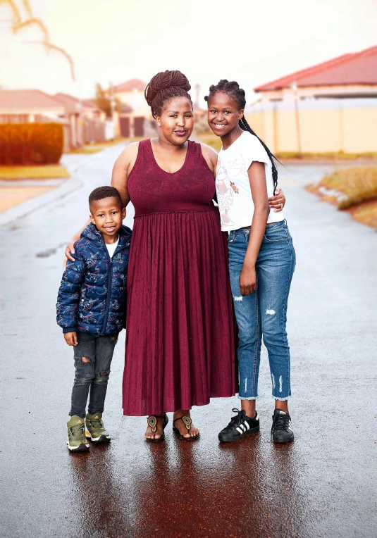 a mother and two children pose for their family portraits