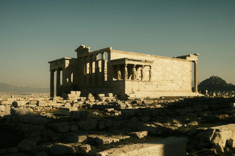 an ancient building is surrounded by rocks