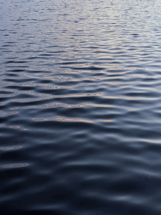 a lake with ripples of water that is blue