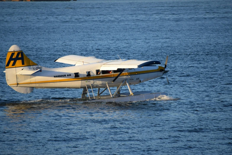 a propeller plane going down the water