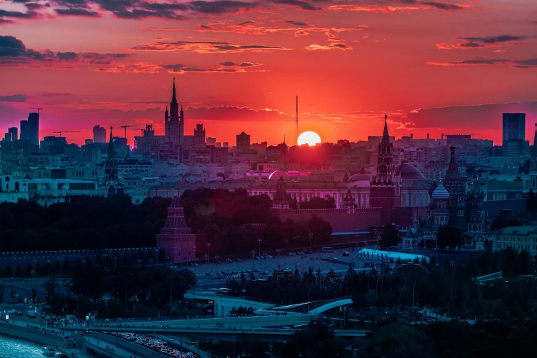 the sun is setting over the city of london