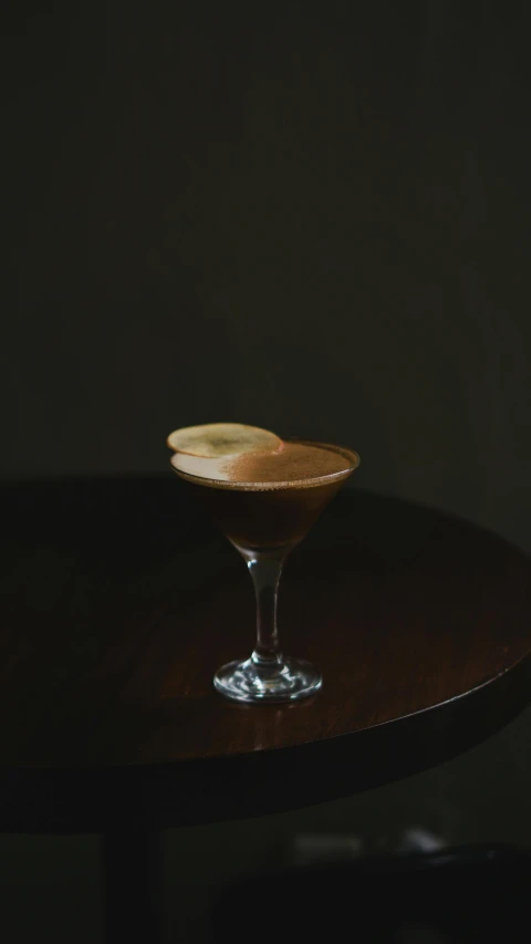 chocolate drink sitting on a table with dark backdrop