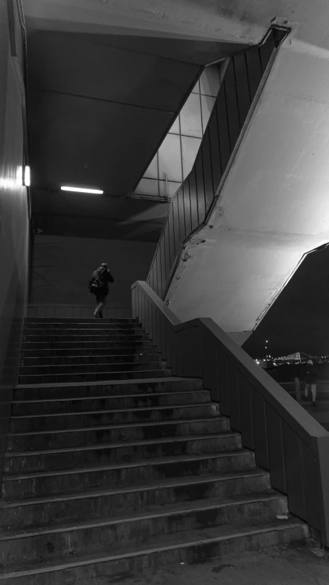 a man riding a skateboard down a flight of stairs