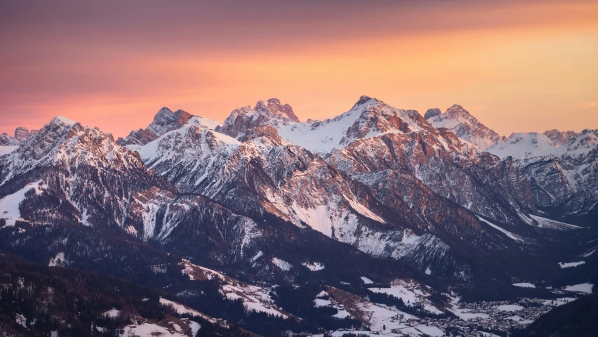 some mountains under the sun as the sun sets