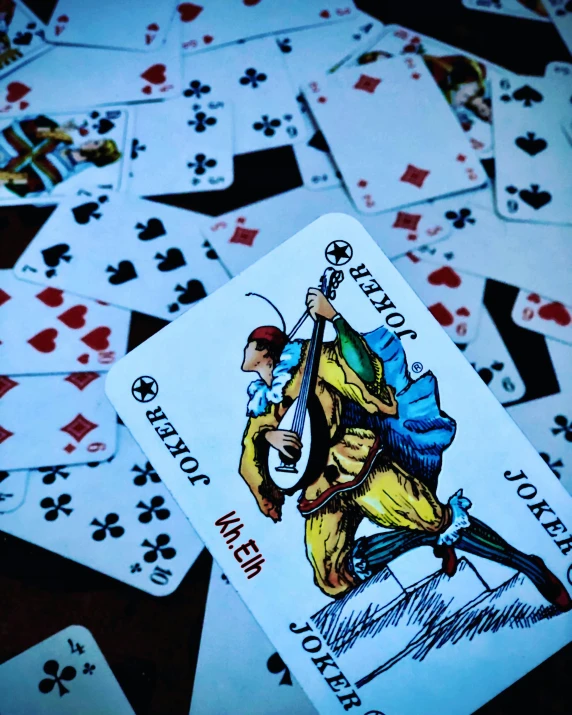 a deck of cards with the ace playing the game