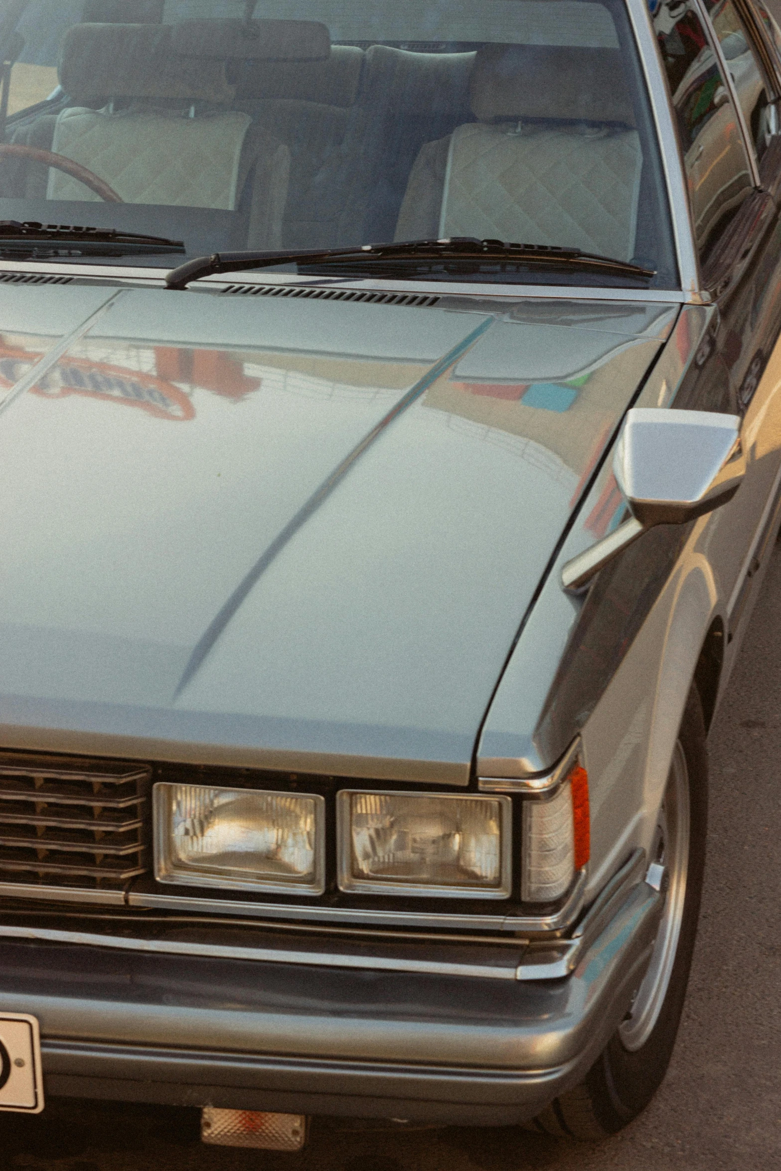 an old - school station wagon is parked on the street