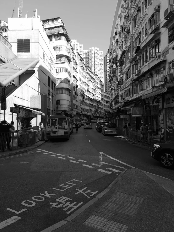 black and white image of a street with buildings