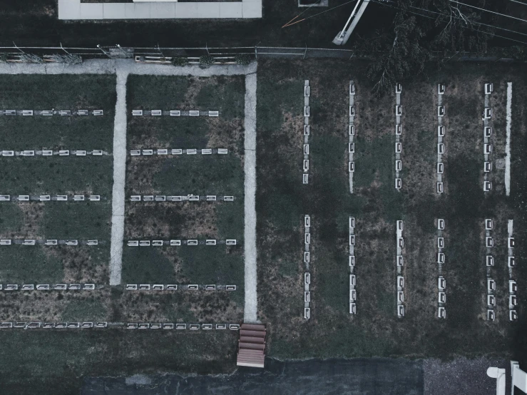 an overhead view shows a parking lot and a bench