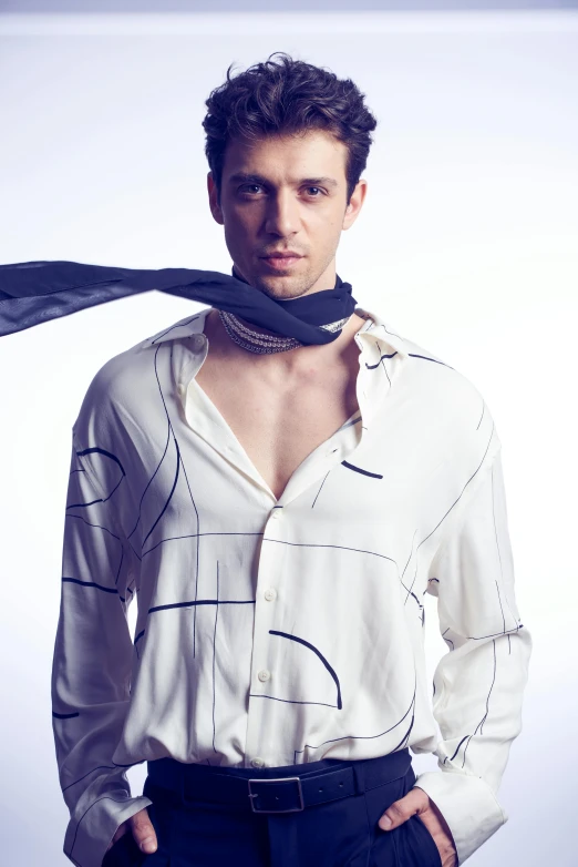 a young man is posing for a picture wearing a shirt and tie