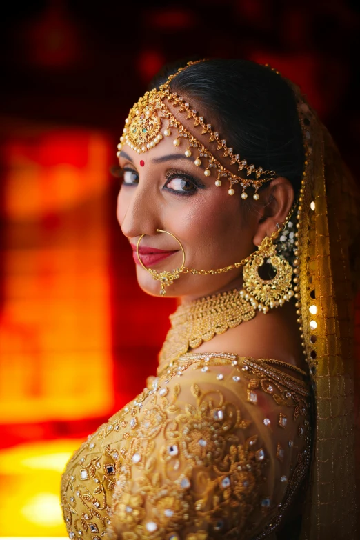 a bride's close up portrait wearing an elaborate outfit