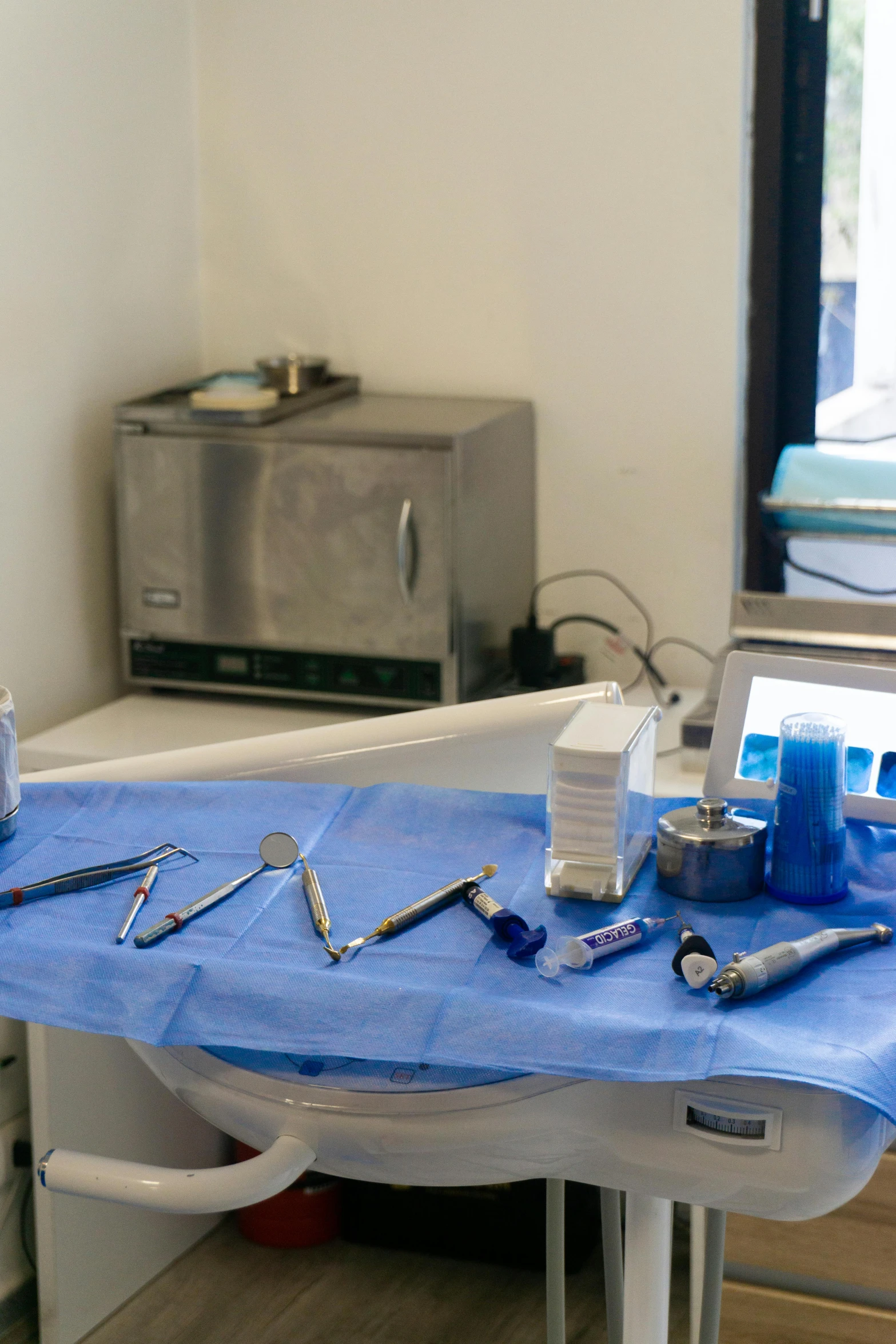 there is a table with dental equipment laid on it