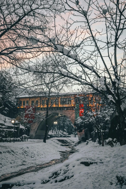 an overpass on a snowy road under the sky