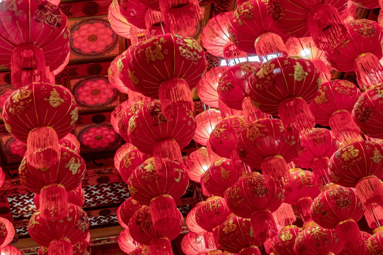 red lanterns hang in the ceiling at a chinese store